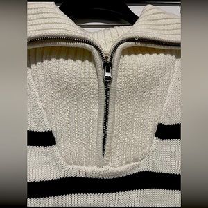 crème colored sweater with black stripes